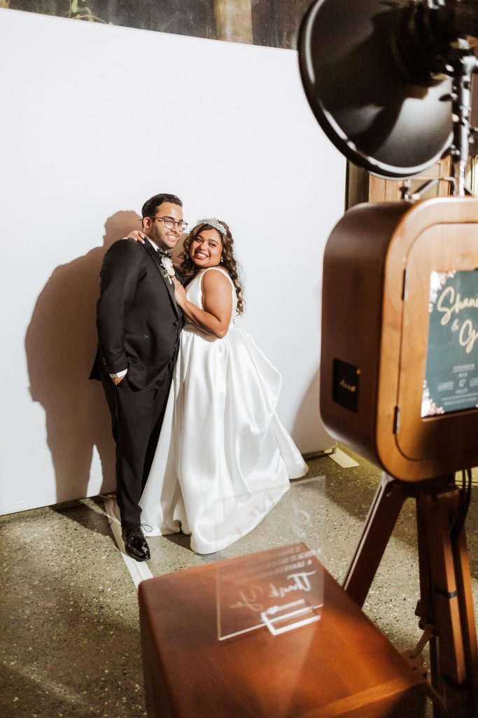 Guests pulling faces with props in the photo booth