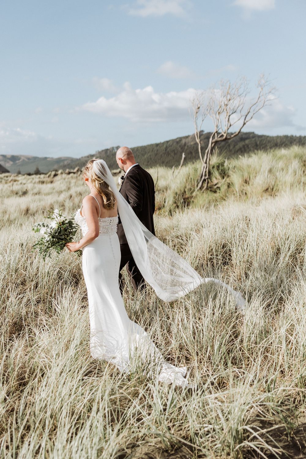 Tui Hill wedding couple at Muriwai beach