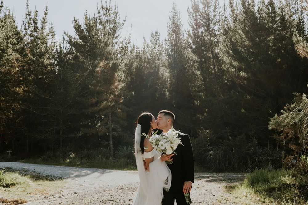 Allely Estate forest wedding kiss
