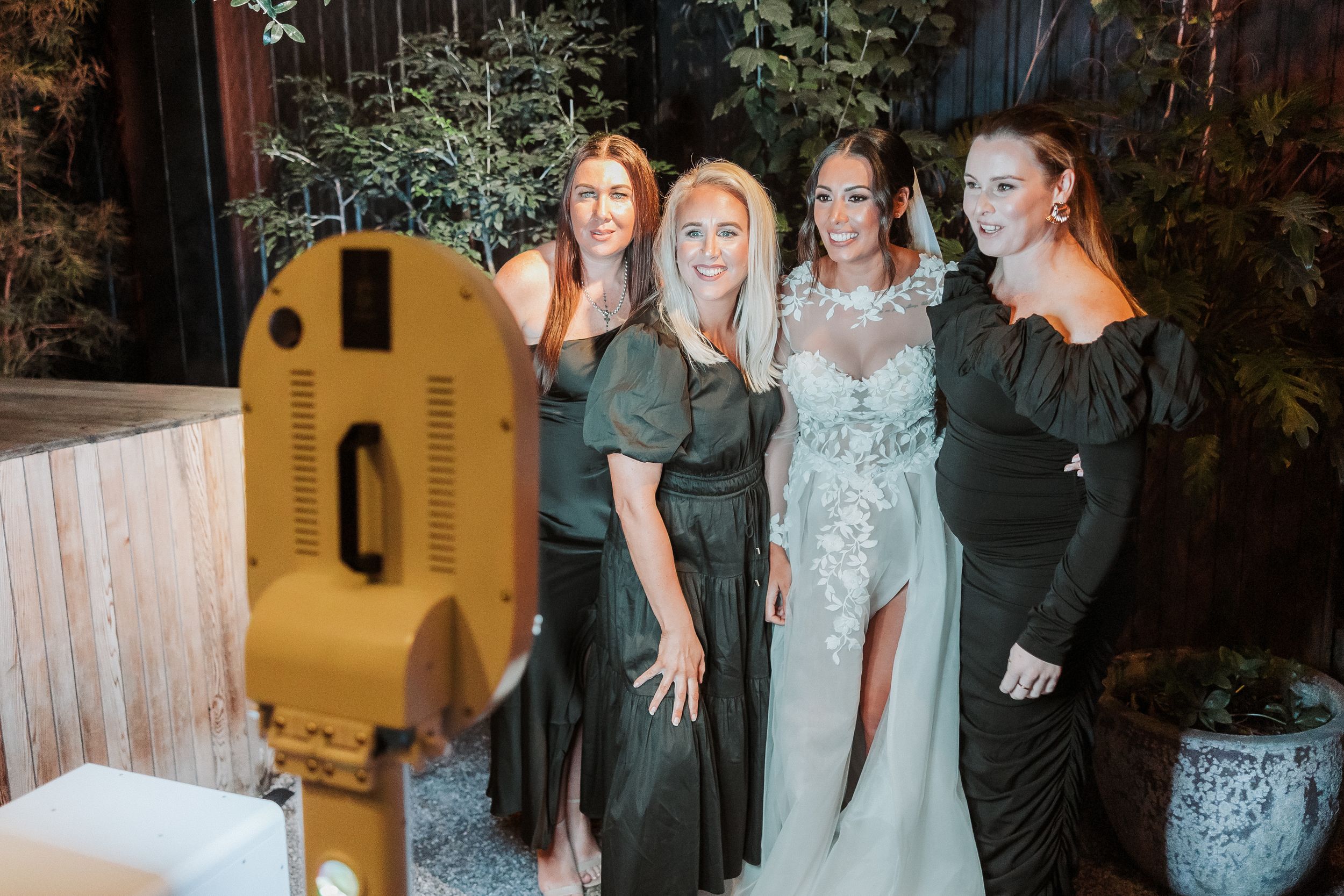 Wedding guests enjoying the photobooth in Auckland
