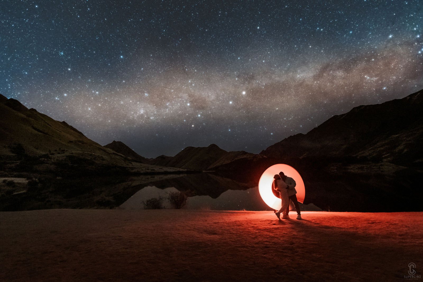 Couple photographed under the Milky Way at night near Queenstown