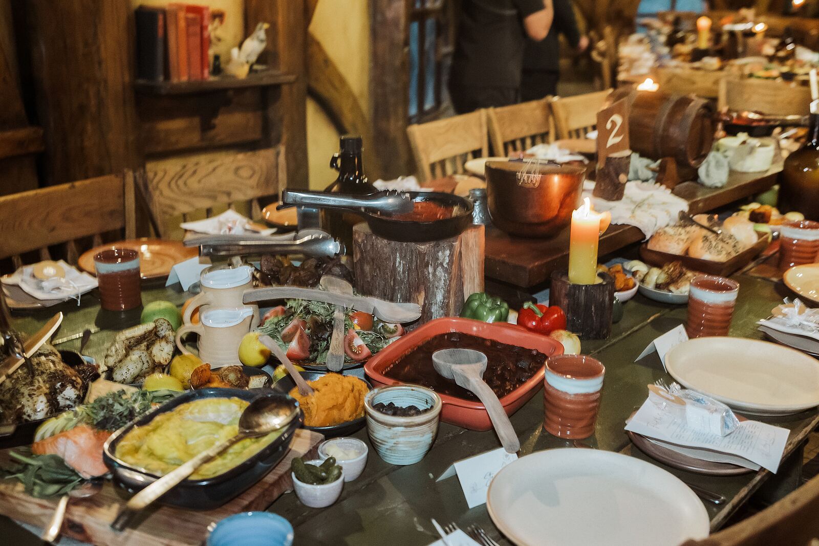 Banquet feast laid out at the Green Dragon Inn, Hobbiton wedding