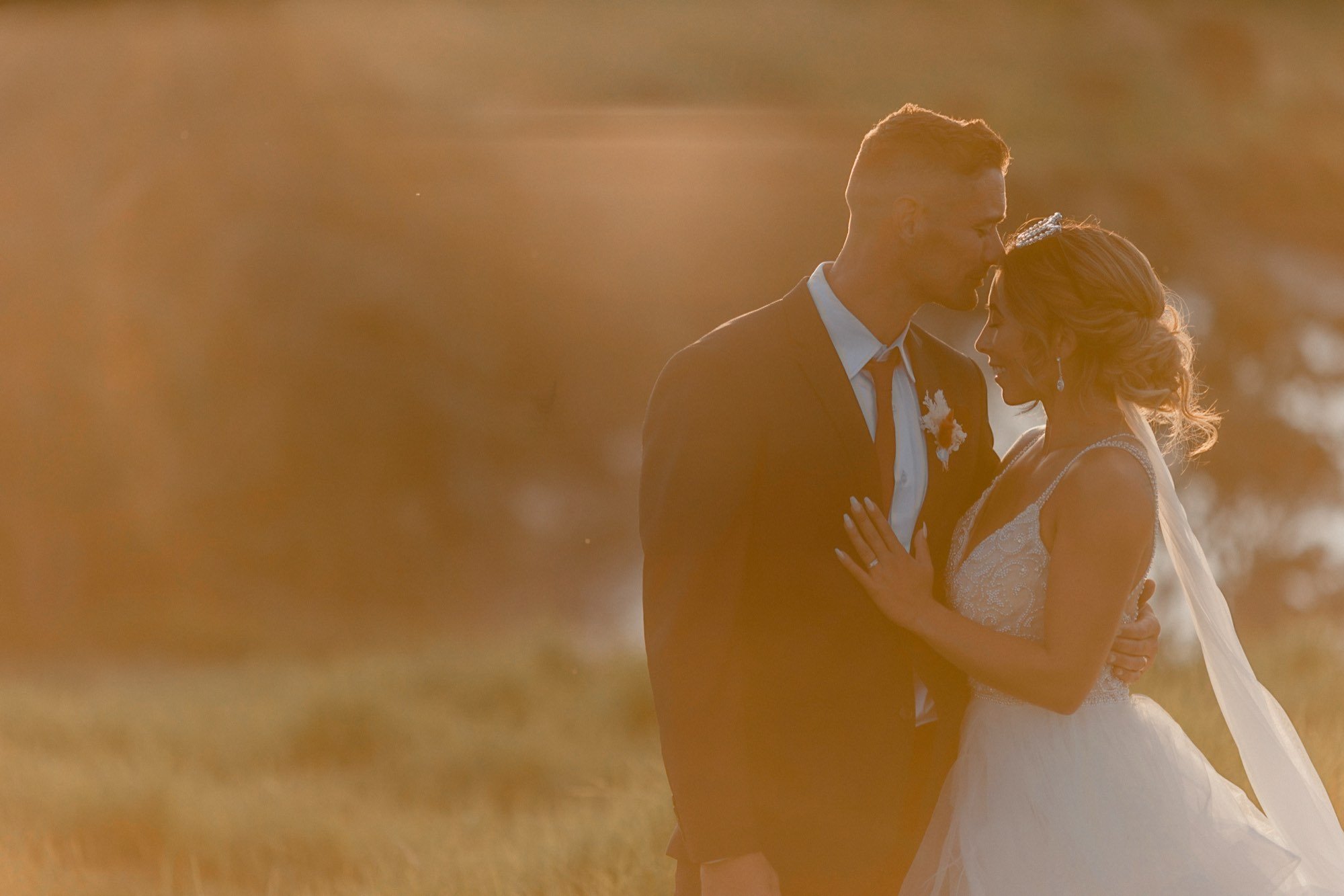 Golden-hour wedding portrait by SuperGibo Photography, Auckland