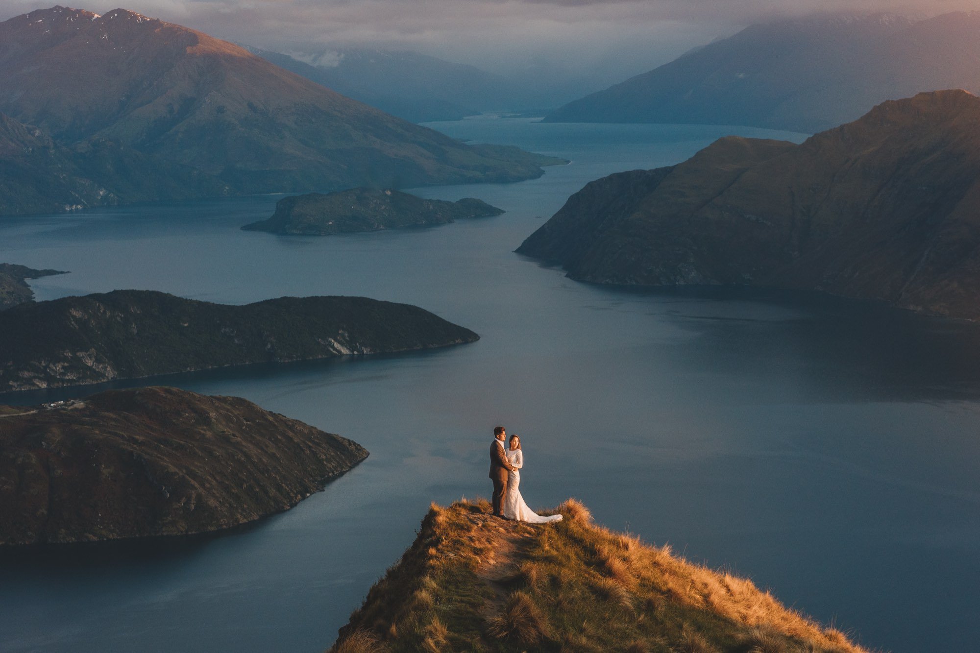 Couple on a clifftop above Lake Wanaka